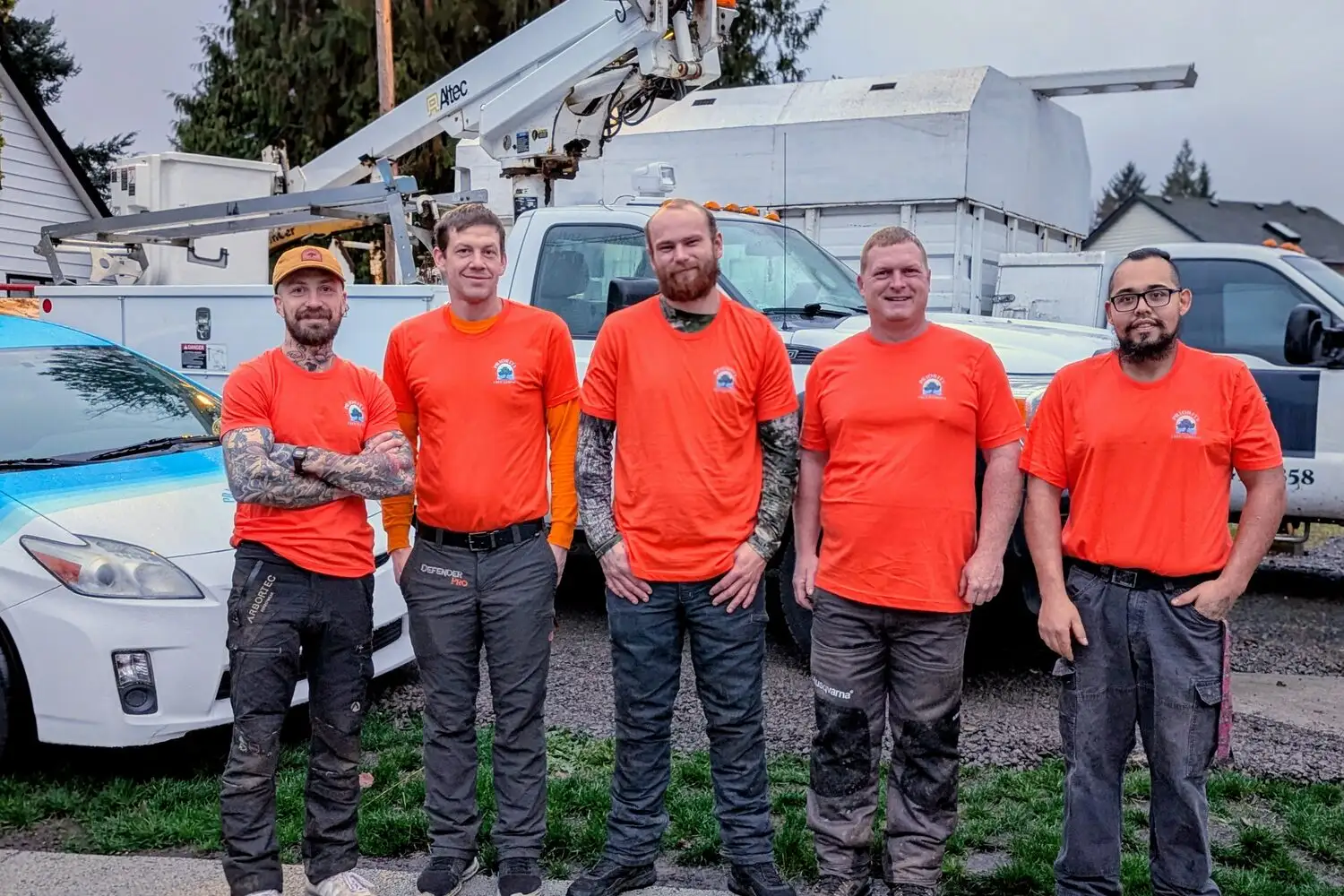 The Priority Tree Service crew in front of their trucks in Vancouver, WA